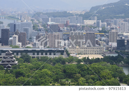 Doctor Yellow running behind Hiroshima Castle 97915813
