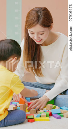 Family playing with building blocks Family playing with building blocks 97916478