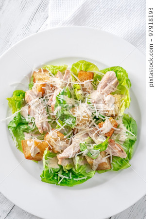 Portion of Caesar salad 97918193