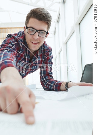 Male Architect With Digital Tablet Studying Plans In Office Male Architect With Digital Tablet Studying Plans In Office 97918919