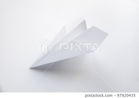 Paper plane origami isolated on a white background Paper plane origami isolated on a white background 97920435