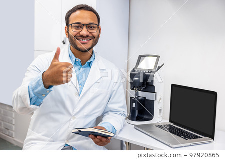 Male doctor in eye glasses looking positive and friendly 97920865