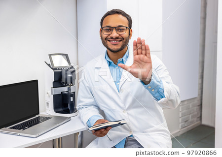 Male doctor in eye glasses looking positive and friendly 97920866