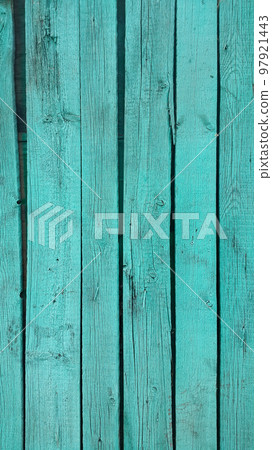 Close-up of bright emerald painted wooden fence 97921443