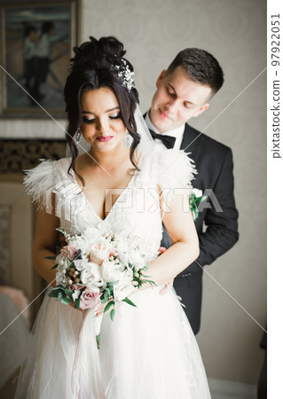 Wedding couple bride and groom holding hands Wedding couple bride and groom holding hands 97922051
