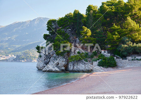 View of a beautiful beach and mountains near Sveti Stefan island in Montenegro, Europe. View of a beautiful beach and mountains near Sveti Stefan island in Montenegro, Europe. 97922622