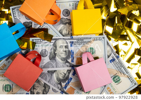 Shopping bags and a money hundred dollar bills, the concept of sale. Shopping bags and a money hundred dollar bills, the concept of sale. 97922928