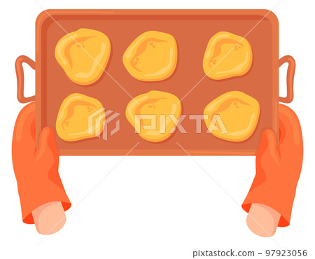 Baking tray with raw cookies in oven mitt hands 97923056