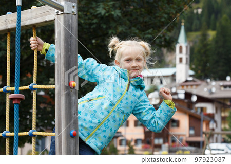 smiling little girl at the playground smiling little girl at the playground 97923087