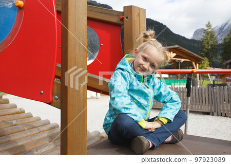 smiling little girl at the playground smiling little girl at the playground 97923089