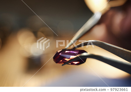 Beautiful gemstone in jeweler's workshop, closeup. Space for text Beautiful gemstone in jeweler's workshop, closeup. Space for text 97923661