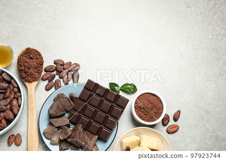 Flat lay composition with organic cocoa butter on light grey table. Space for text Flat lay composition with organic cocoa butter on light grey table. Space for text 97923744