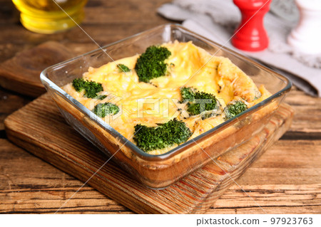 Tasty broccoli casserole in baking dish on wooden table Tasty broccoli casserole in baking dish on wooden table 97923763