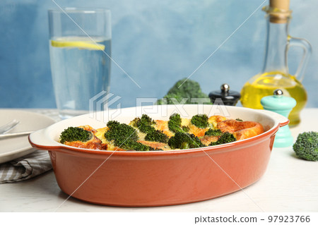 Tasty broccoli casserole in baking dish on white wooden table Tasty broccoli casserole in baking dish on white wooden table 97923766