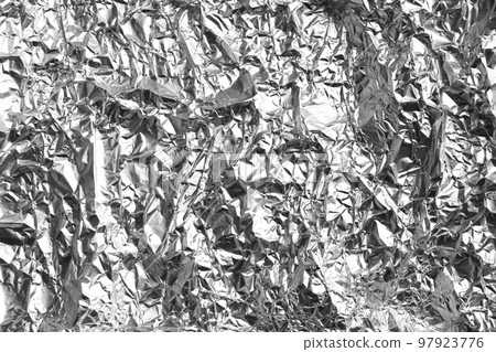 Crumpled silver foil as background, closeup view 97923776
