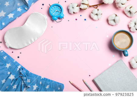 Flat lay composition with sleeping mask on pink background, space for text. Bedtime accessories Flat lay composition with sleeping mask on pink background, space for text. Bedtime accessories 97923825