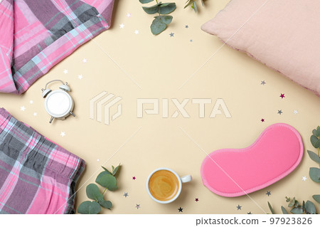 Flat lay composition with sleeping mask on yellow background, space for text. Bedtime accessories Flat lay composition with sleeping mask on yellow background, space for text. Bedtime accessories 97923826