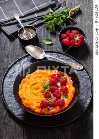 Sweet Potato Mash topped with fresh Raspberries Sweet Potato Mash topped with fresh Raspberries 97924324