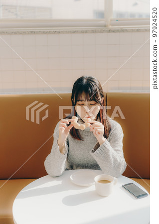 young college girl in cafe 97924520