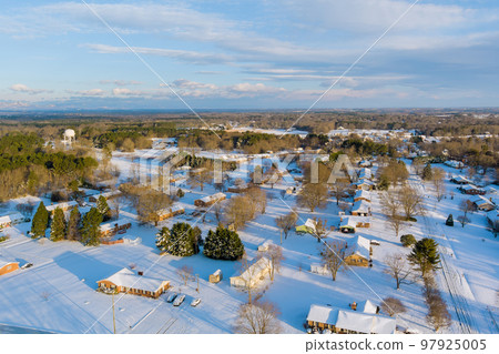 In South Carolina State US an American small town after big snowfall is seen from aerial view that beautiful snow scenes. 97925005