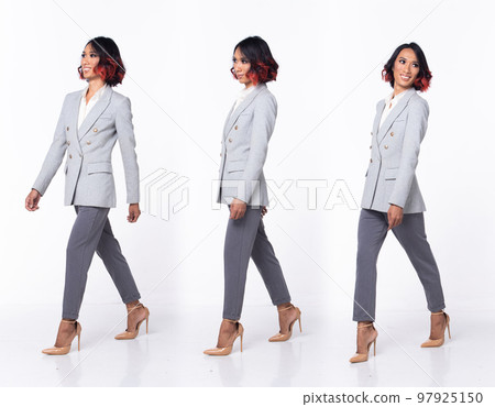 Full length 20s Asian Woman wear formal Business dress blazer high heel shoes. Black short curl hair female walking happy smile tanned skin, walk forward left right over white background isolated 97925150
