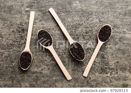 quinoa seeds in spoon on colored background. Healthy kinwa in small spoon. Healthy superfood 97926513