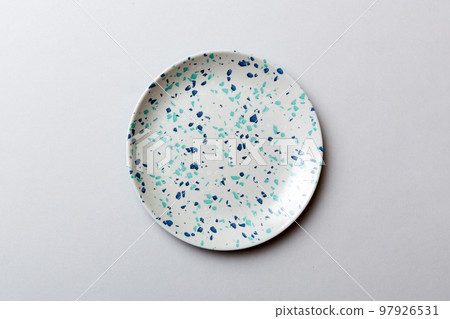 Top view of isolated of colored background empty round blue plate for food. Empty dish with space for your design Top view of isolated of colored background empty round blue plate for food. Empty dish with space for your design 97926531