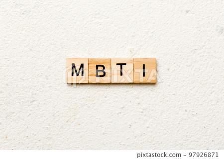 MBTI word written on wood block. Myers-Briggs Type Indicator text on table, concept 97926871
