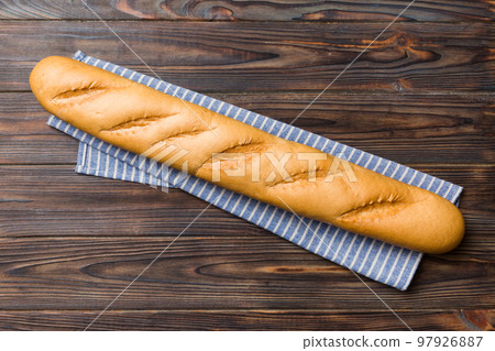 fresh crunchy french baguette on colored table. Top view Bakery products 97926887