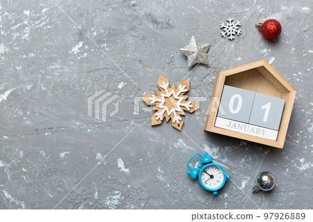 Christmas wood calendar with new year decorations, aganist colored background. Christmas calendar 1 january Christmas wood calendar with new year decorations, aganist colored background. Christmas calendar 1 january 97926889
