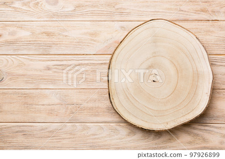 Top view of wooden serving tray on wooden background. Empty space for your design Top view of wooden serving tray on wooden background. Empty space for your design 97926899