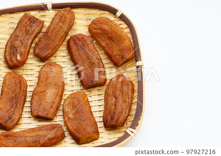 Sun dried bananas on white background. Sun dried bananas on white background. 97927216