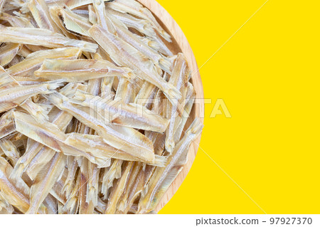 Dried anchovy on yellow background. Dried anchovy on yellow background. 97927370