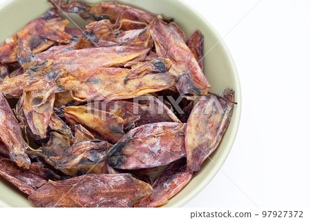 Dried squid in green bowl 97927372