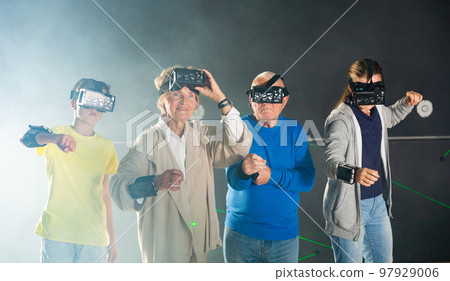 Grandparents and grandkids playing VR games together 97929006