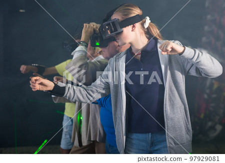 Teenage girl playing VR games with her family 97929081