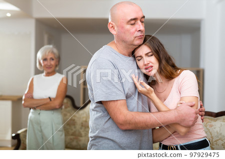 Senior man consoling his daughter 97929475