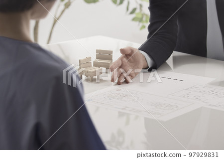 Hands of two women who conclude a real estate contract 97929831
