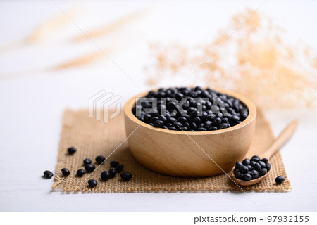 Black soybean seeds in bowl with spoon, food ingredients high protein good for vegetarian and vegan Black soybean seeds in bowl with spoon, food ingredients high protein good for vegetarian and vegan 97932155