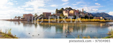 Old Residential Homes near river and sea in Ventimiglia, Italy. 97934965
