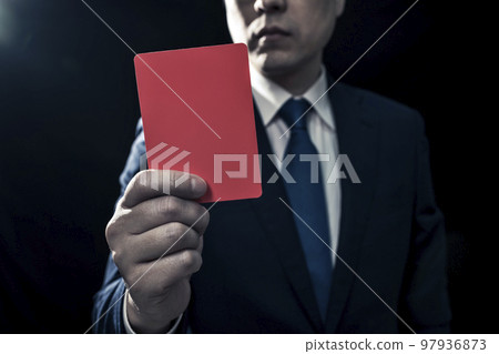 Male business person presenting a red card 97936873
