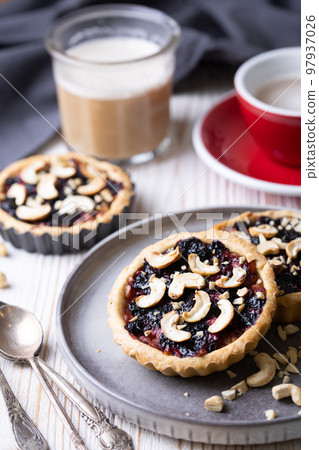 tartlets with apple jam and blueberry confiture tartlets with apple jam and blueberry confiture 97937026