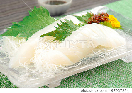 Squid sashimi served on a glass plate Squid sashimi served on a glass plate 97937294