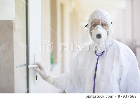 A doctor in a protective suit during an epidemic. pandemic, coronavirus. A doctor in a protective suit during an epidemic. pandemic, coronavirus. 97937662