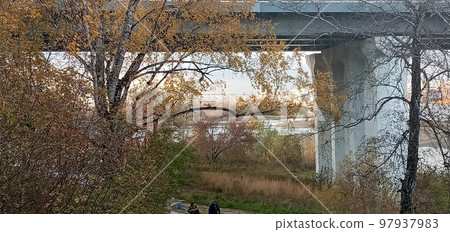 Novosibirsk, Siberia, Russia-08.15.2020: Panorama of Novosibirsk on the Ob river. The capital of Siberia on the great Siberian river, bridges, lush vegetation on river Islands, city buildings Novosibirsk, Siberia, Russia-08.15.2020: Panorama of Novosibirsk on the Ob river. The capital of Siberia on the great Siberian river, bridges, lush vegetation on river Islands, city buildings 97937983