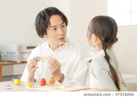 Parents and children studying money Parents and children studying money 97938066