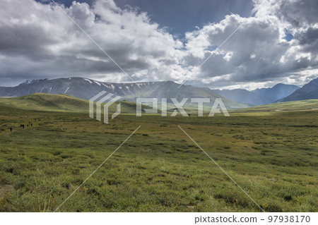 Green mountain valley and sky, travel. On the Oroy pass. Mountain Altai. Siberia. Russia. Green mountain valley and sky, travel. On the Oroy pass. Mountain Altai. Siberia. Russia. 97938170