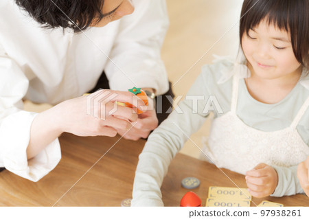 Parents and children studying money 97938261