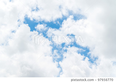 Beautiful white fluffy clouds in blue sky. Nature background from white clouds in sunny day Beautiful white fluffy clouds in blue sky. Nature background from white clouds in sunny day 97938770