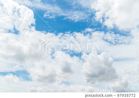 Beautiful white fluffy clouds in blue sky. Nature background from white clouds in sunny day Beautiful white fluffy clouds in blue sky. Nature background from white clouds in sunny day 97938772
